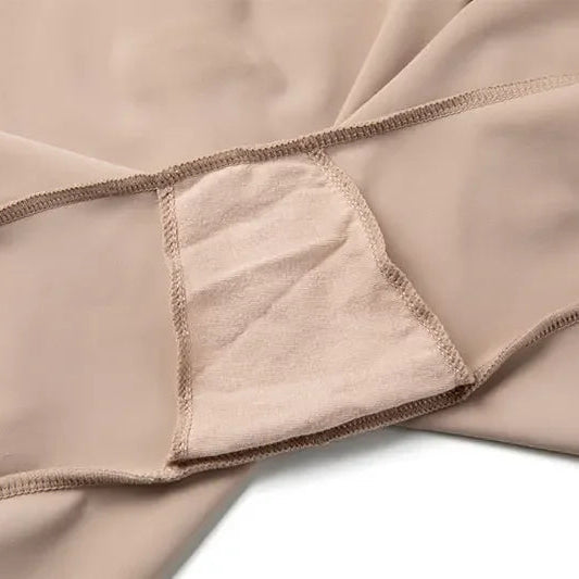 Close-up of beige fabric with a focus on texture, stitching detail and cotton fabric